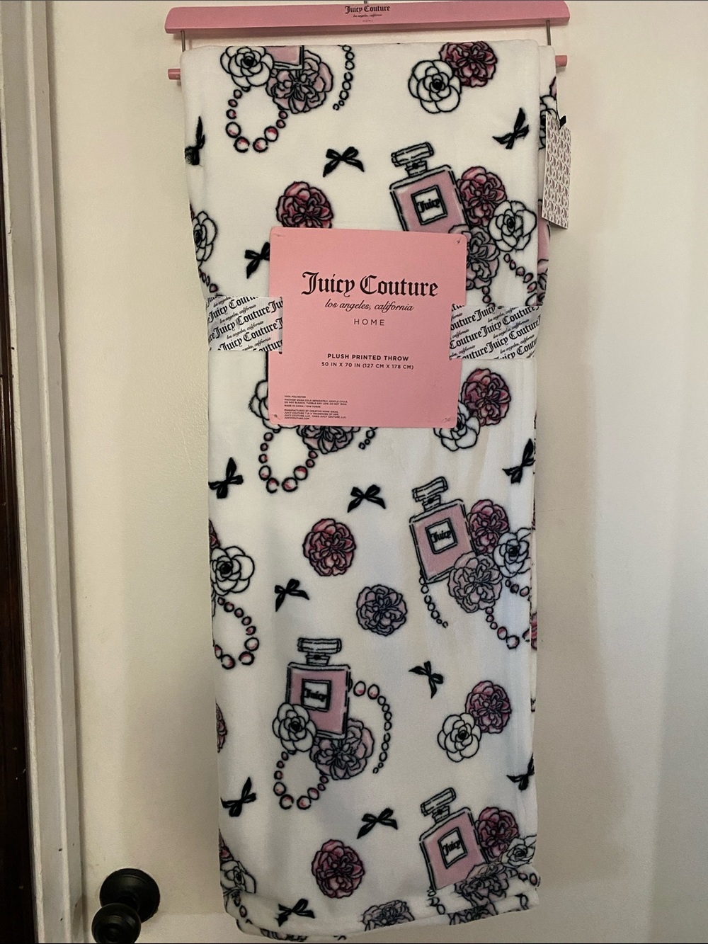 Juicy Couture White Plush Throw with Pink Perfume Bottle and Black Accents